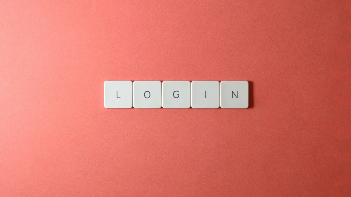 Teclas formam a palavra login sobre fundo sóbrio.